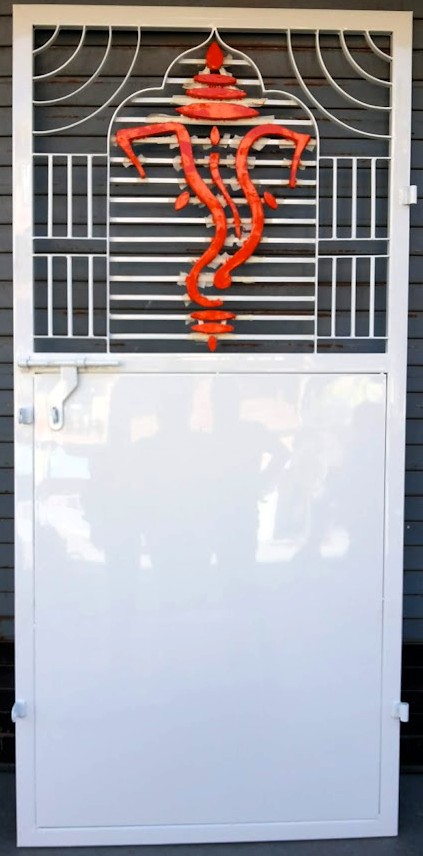 A designer safety door featuring a beautiful floral laser-cut pattern.